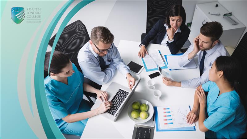 Healthcare professionals and business team in a meeting discussing medical charts and data analysis